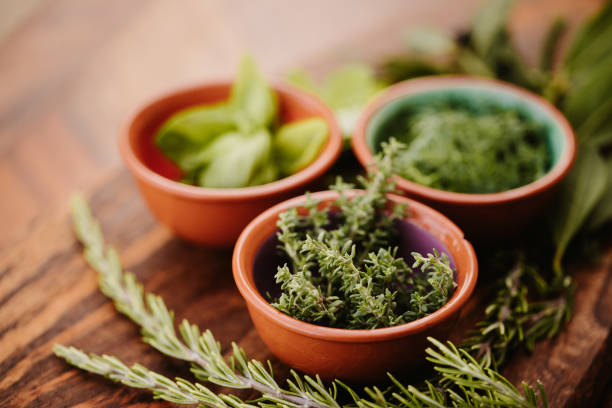 istock Three different tasty herbs on a rustic wooden board with focus on the thyme 1285669199