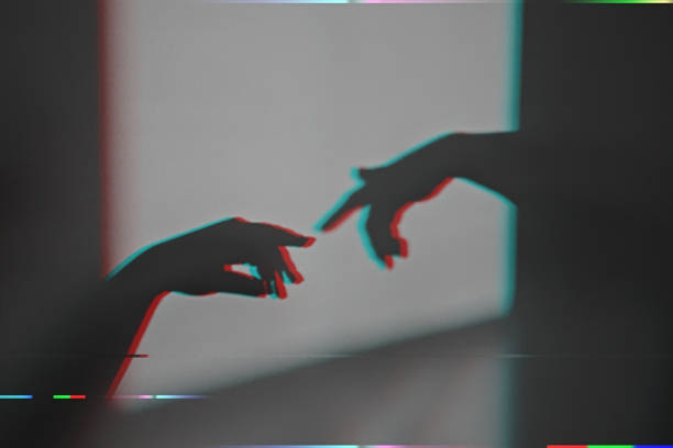 istock Shadow silhouette of touch by human wrists on wall during posing with anaglyph  effect 1285670432
