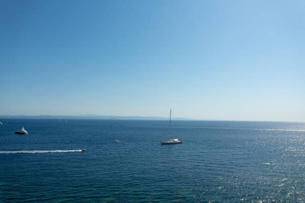 Beautiful seascape with boats and distant shore