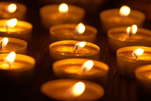 istock Many burning candles with shallow depth of field 1285675717