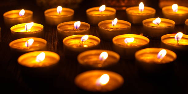 istock Many burning candles with shallow depth of field 1285675822