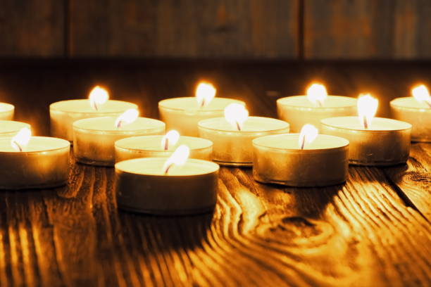 istock Many burning candles with shallow depth of field 1285675845