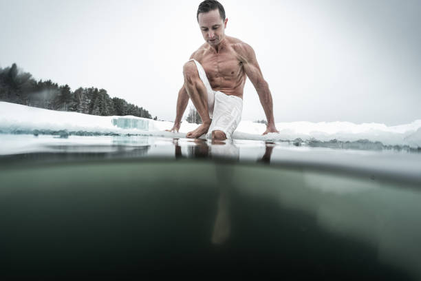 istock Young man swims in the ice hole 1285676141