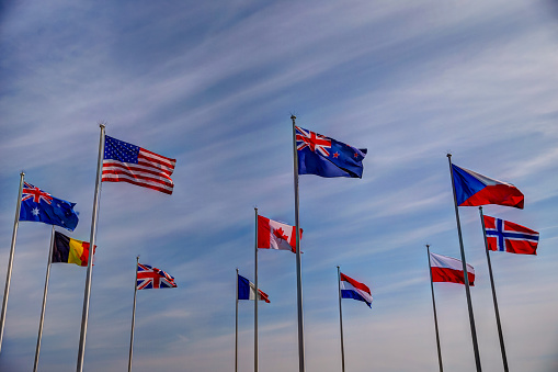 Normandy, France: July 6, 2019: Nations flags along Juno Beach in Normandy France