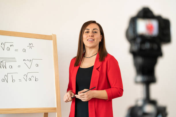 istock A female teacher who records online lessons with a board for her students who will receive distance education during the pandemic period 1285677280