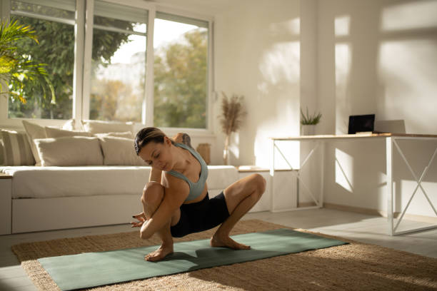 istock Young fit Caucasian woman doing exercises at home 1285679720