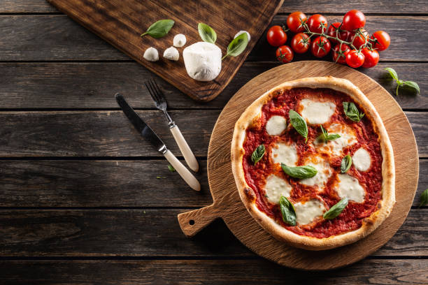 Pizza Napoletana - Napoli tomato sauce mozzarella and basil Pizza Napoletana - Napoli tomato sauce mozzarella and basil - top of view. southern italy photos stock pictures, royalty-free photos & images