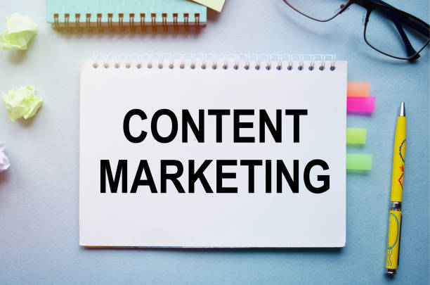 istock The inscription CONTENT MARKETING. Handwritten text in a notebook on the background of financial tables. 1285682614