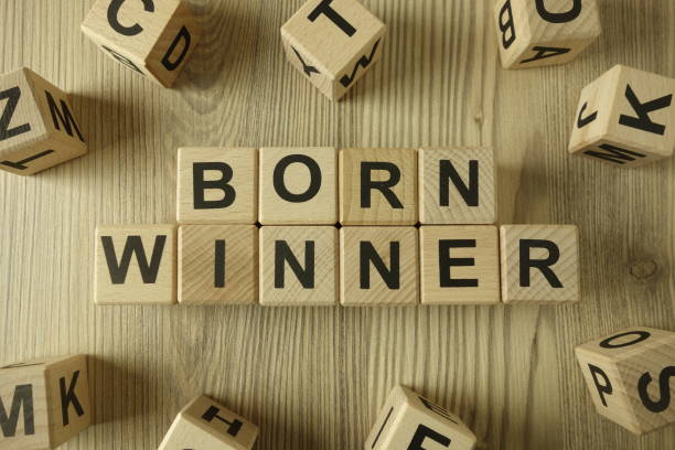 istock Text born winner from wooden blocks 1285684508