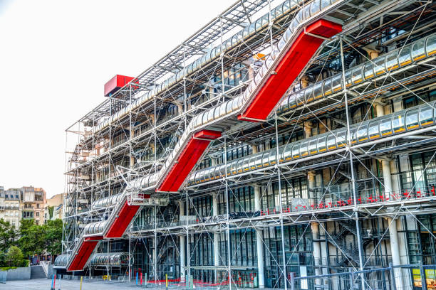 Exterior of the Pompidou Center designed by Renzo Piano and Richard Rogers featuring exposed pipes and infrastructure Paris, France - July 5, 2019: Exterior of the Pompidou Center designed by Renzo Piano and Richard Rogers featuring exposed pipes and infrastructure pompidou center stock pictures, royalty-free photos & images