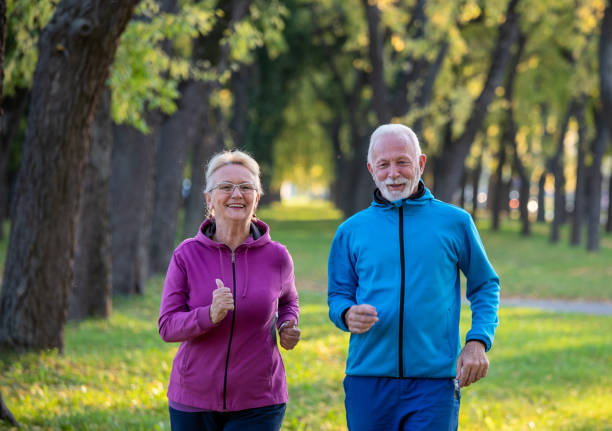 istock Senior couple jogging in autumn 1285684797