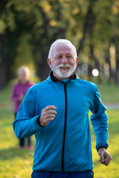 istock Senior people jogging in park 1285684814