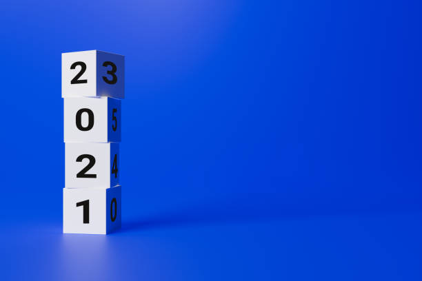 istock christmas concept, written on white cubes 2021 on a blue background, copy space 1285686740