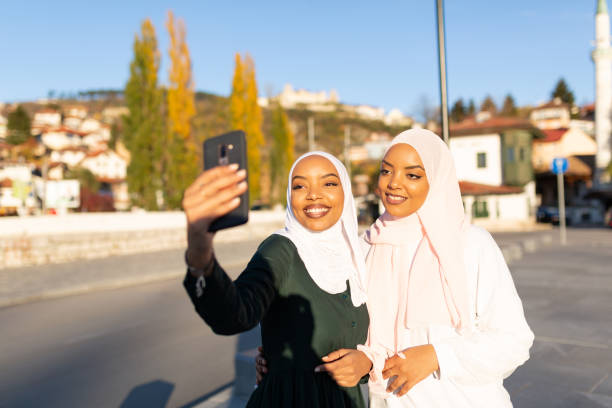 istock Two happy Middle eastern female tourists having fun together 1285686763