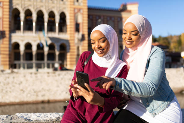 istock Two happy Middle eastern female tourists having fun together 1285686804