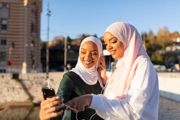 istock Two happy Middle eastern female tourists having fun together 1285686830