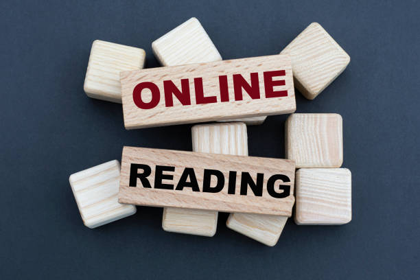 istock ONLINE READING - words on wooden bars on cubes on a gray background 1285686947