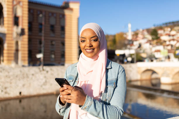 istock Portrait of a young middle eastern woman using a smart phone 1285687021