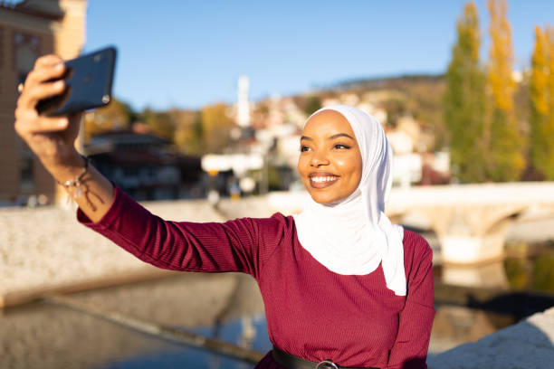 istock Young middle eastern woman using a smart phone 1285687077