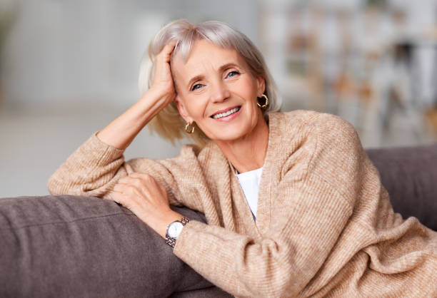 istock elderly beautiful woman smiles at   camera while sitting on the 1285690006