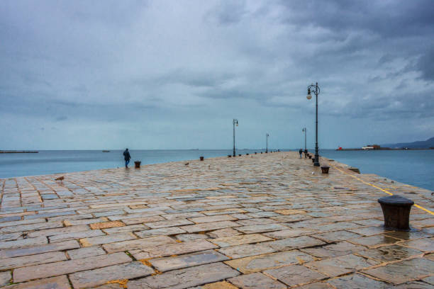 Gravel road at breakwater on the Guadiana River in city Vila Real Santo Antonio, Algarve, Portugal