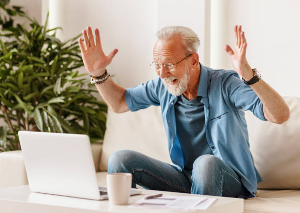istock Excited senior freelancer celebrating success 1285690718