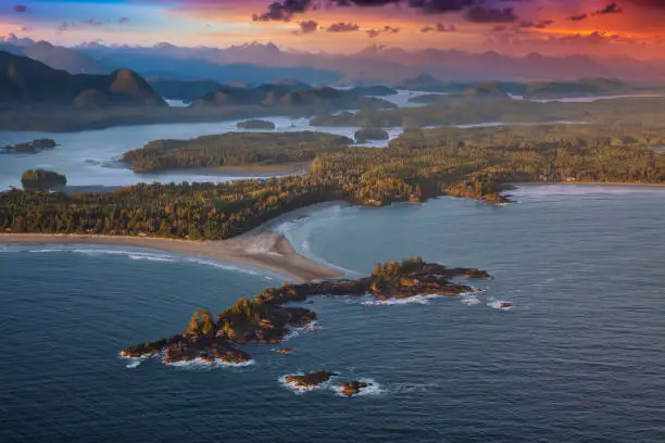 Aerial Canadian Landscape at the West Pacific Ocean Coast during a colorful vibrant sunset. Taken in Tofino, Vancouver Island, British Columbia, Canada.