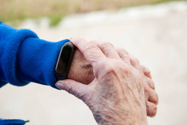 istock Senior woman using wearable watch 1285691243
