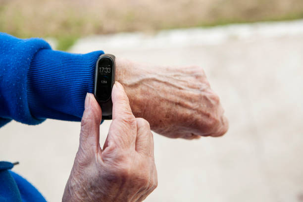 istock Senior woman using wearable watch 1285691259