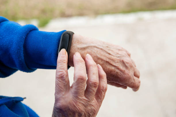 istock Senior woman using wearable watch 1285691260