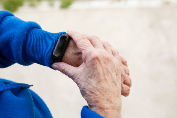 istock Senior woman using wearable watch 1285691277