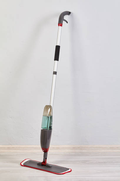 istock Mop for cleaning floor with special liquid and microfiber cloth inside flat. 1285693196