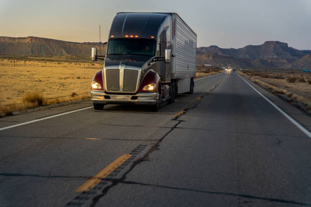 istock Driving On A Two-Lane Highway A Semi Truck Is Heading In The Opposite Direction Hauling Goods To The Final Destination 1285697708