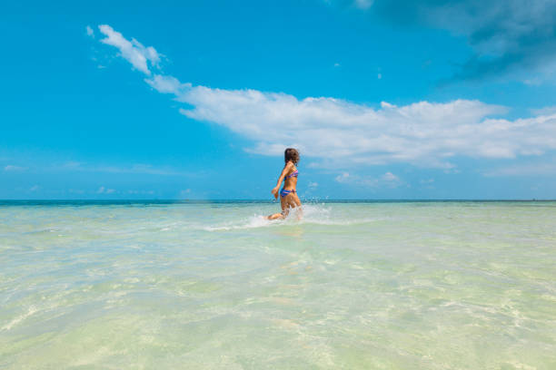 istock Woman at tropical beach 1285702915