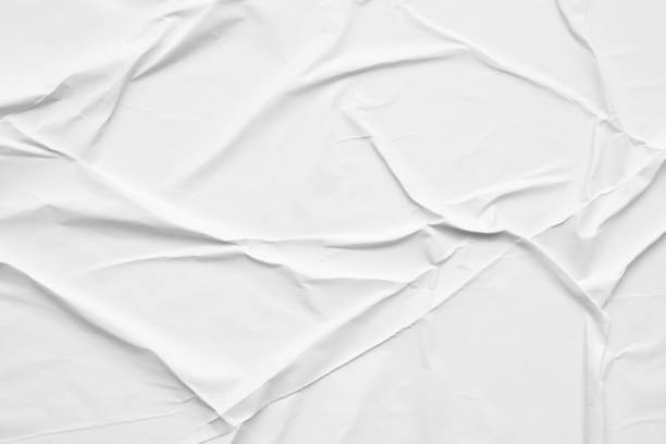 istock Blank white crumpled and creased paper poster texture background 1285703620