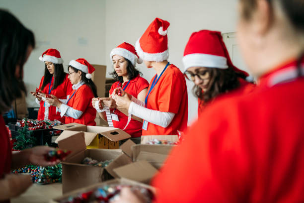 istock Female charity team during their work by making presents 1285703692