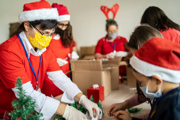 istock Volunteers packing presents for Christmas 1285703695