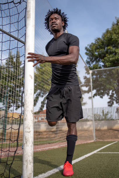 istock Football player black pre match 1285703907