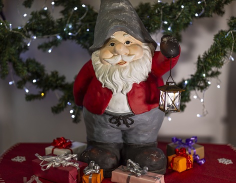 Close up view of cute gnome figure on christmas decoration background. Christmas holidays concept.