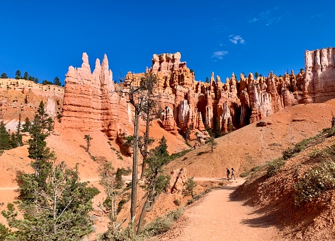 Bryce Canyon NP, Utah - September 6, 2020: Hikers on Queens Garden Trail in Bryce Canyon National Park in Utah.