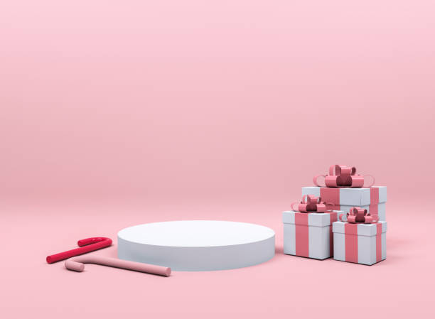 istock White gift box red ribbon among candy pink background. Minimal Christmas concept idea 3d render. Podium for product display 3d rendering. 1285708129