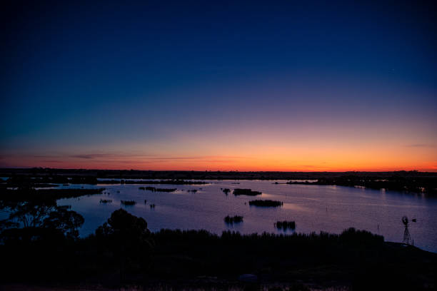 Tailem Bend Sunset Tailem Bend, Australia - November, 17 2019: The sun sets over the famous Murray River in the township of Tailem Bend in remote South Australia. murray darling basin stock pictures, royalty-free photos & images