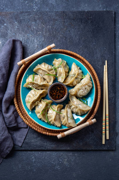 istock Asian Potstickers dumplings Gyoza with Soy Sauce 1285711384