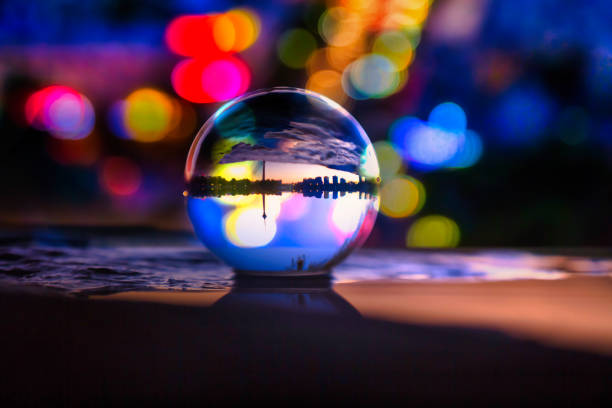Select focus to shoot the city skyline and dreamy lighting effects from the crystal ball perspective