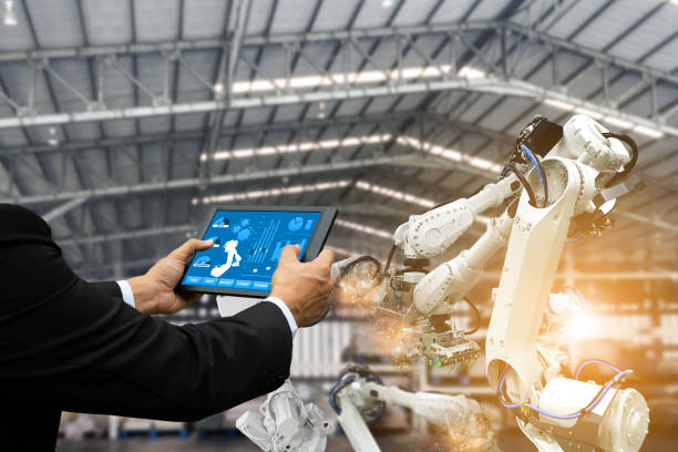 istock Manager engineer check control automation Robotic arms, industrial robots, factory automation machines 1285723003