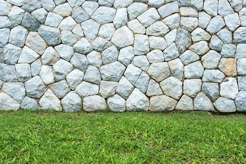 Irregularly shaped stone brick wall texture background
