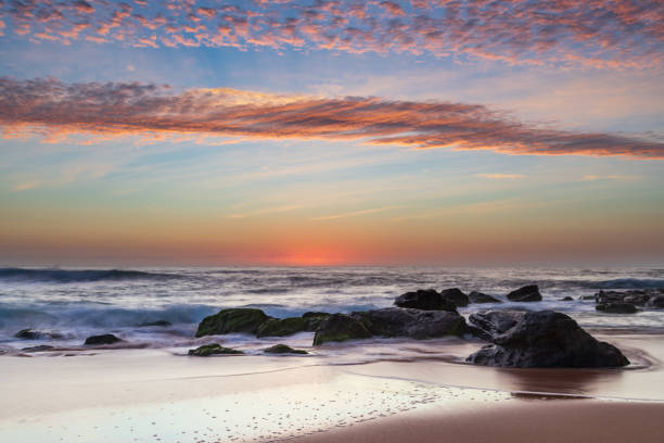 istock Beautiful sunrise with high cloud at the seaside 1285725155
