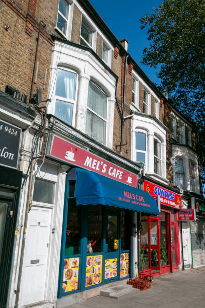 Mel's Cafe in South Bermondsey, London Mel's Cafe in South Bermondsey, London, with other stores also visible bermondsey street restaurants stock pictures, royalty-free photos & images