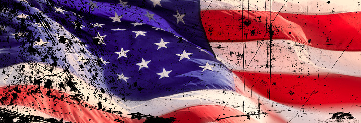 Conceptual image of close up damaged American flag
