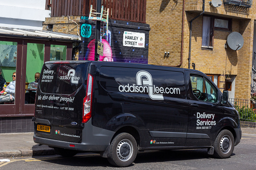 Addison Lee Delivery Services in Camden, London, with Hawley Street in the background and people visible.